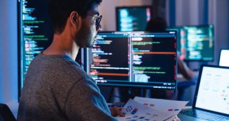 Asian,Software,Developers,Working,On,Multiple,Screens,Displaying,Code,And Asian,Software,Developers,Working,On,Multiple,Screens,Displaying,Code,And